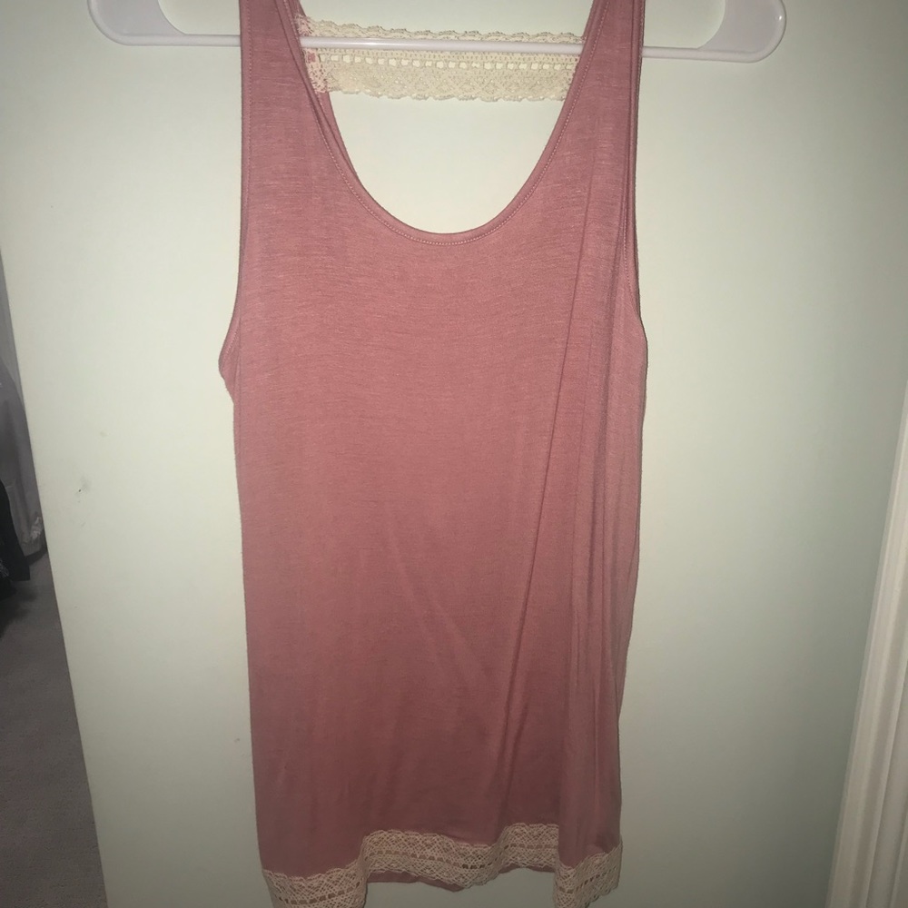 Adorable tank with lace accents!
